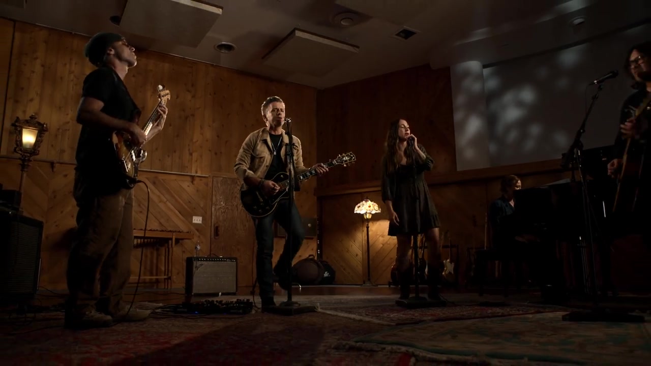 Eric Hirshberg and the band performing in The Grand Elsewhere
