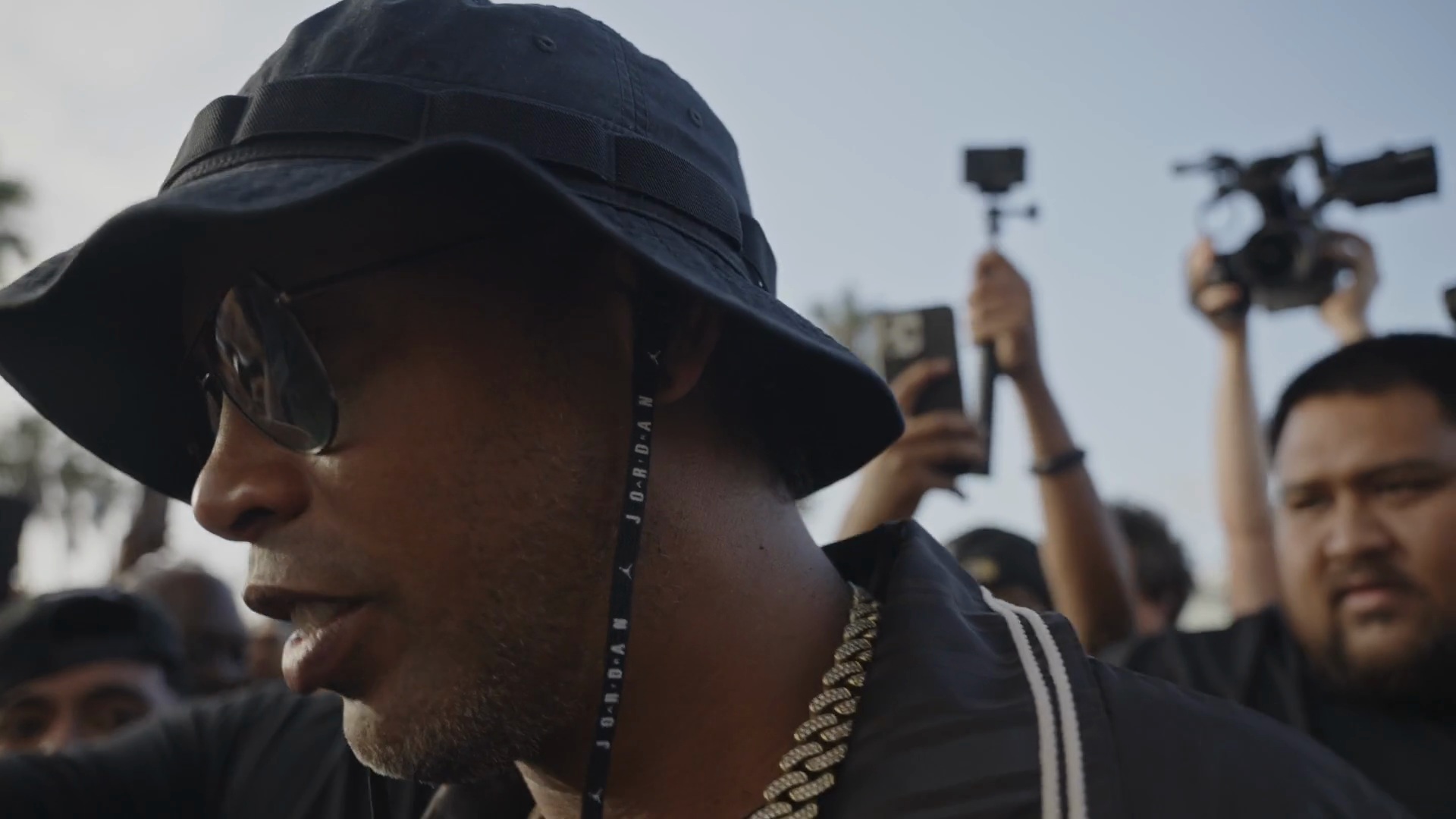 Ronaldinho arriving among a crowd at Venice Beach